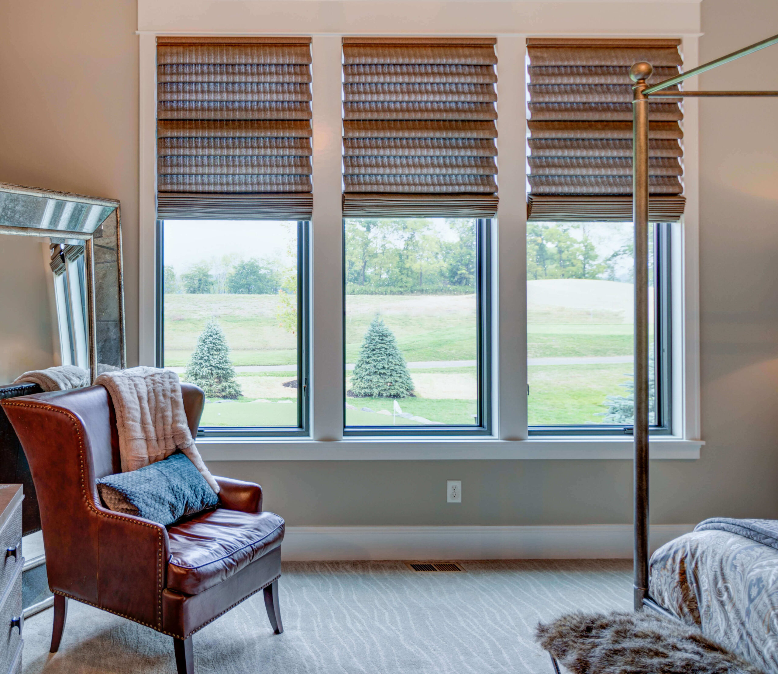Window treatments that don't hide trim - Hunter Douglas Alustra® Collection of Vignette® Modern Roman Shades mounted inside the trim