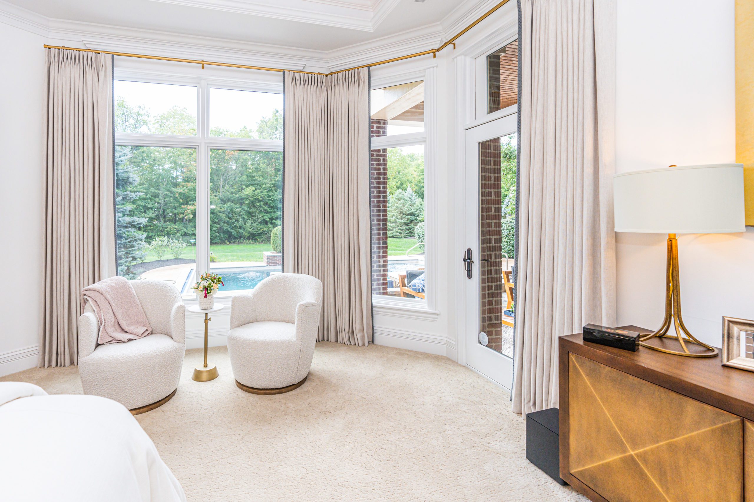 Warm neutral bedroom sitting area