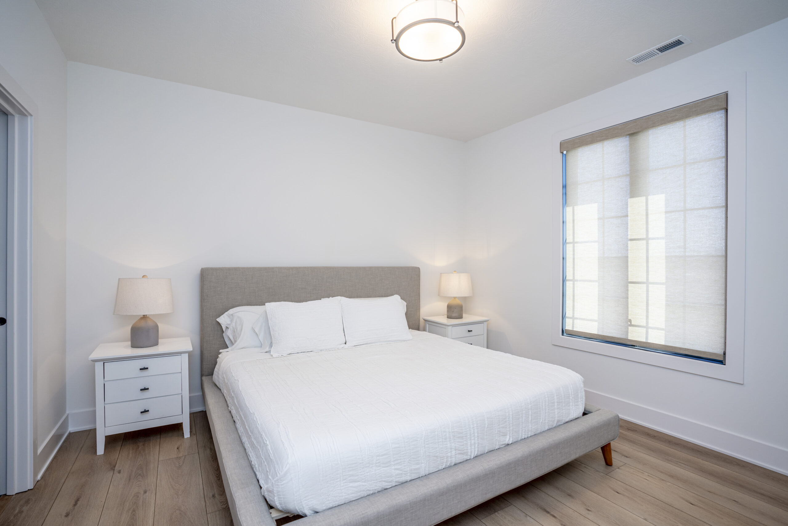 Guest bedroom with roller shades
